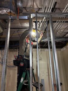 Electrician installing lighting